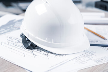 helmet and tools for construction drawings and construction drawings close-up, selective focus,...