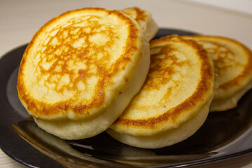delicious pancakes on a plate are on the table close up