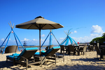 Place for beach holidays with umbrellas and chaise longue in Nusa Dua Beach, Bali island, Indonesia