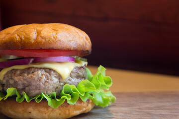 Homemade burger with meat patty and vegetables