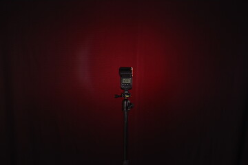 Camera external flash isolated on black background. illustration of professional equipment such as professional studio lighting