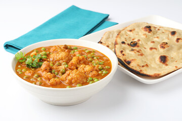 gobi mutter curry, cauliflower mutter curry, gobi masala with green peas indian food, served with roti or Chapati lunch ,dinner