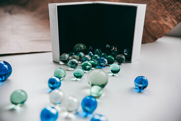 colored balls are poured out of the box