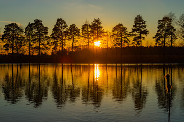 Fototapeta premium Beautiful sunset on river Kymijoki in February, Finland.
