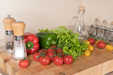 Fresh vegetables on wooden table in kitchen