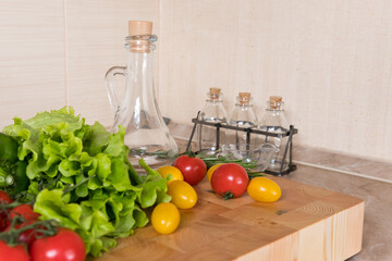 Fresh vegetables on wooden table in kitchen