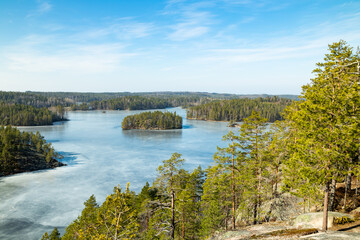 Fototapeta na wymiar Beautiful landscape with icy lake in the national park Repovesi, Finland