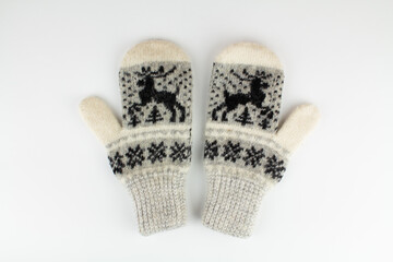 women's winter knitted mittens on a white background