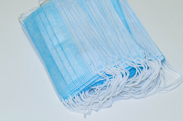 Disposable medical mask. Blue protective mask isolated on white background