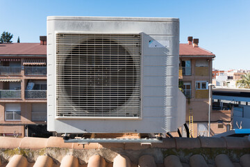 air conditioning machine on the roof of the house. Rooftop air conditioning condenser.