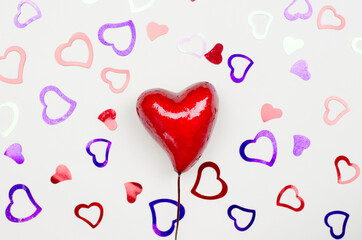 Hearts on a beige background. Valentine's Day background.