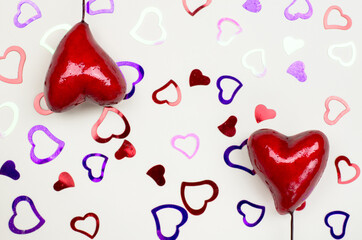 Hearts on a beige background. Valentine's Day background.