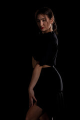 Young Woman in a black dress dancing, Young professional dancer practicing in a studio , dancer
