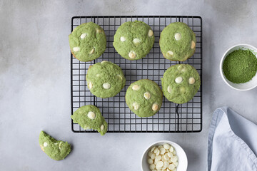flat lay composition with green tea matcha cookies on cooling rack. Healthy trendy dessert. gray...