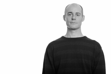Portrait of handsome bald man looking at camera
