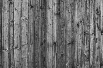 Natürliche Holztextur in schwarz und weiß. Holzbretter mit Nägeln als Hintergrund. Raue Beschaffenheit von Materialien.