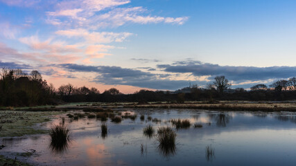 Fototapeta na wymiar Sunrise over the Bowling Green Marsh and River Clyst, Topsham, Devon, England, Europe