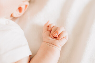 baby hands and fingers close up on white background