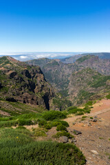 Fototapeta na wymiar Beautiful panorama view of the landscape in the mountains at Pico do Areeiro with blue sky, Madeira Island