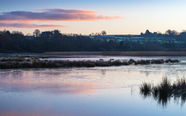 Obraz na płótnie Canvas Sunrise over the Bowling Green Marsh and River Clyst, Topsham, Devon, England, Europe