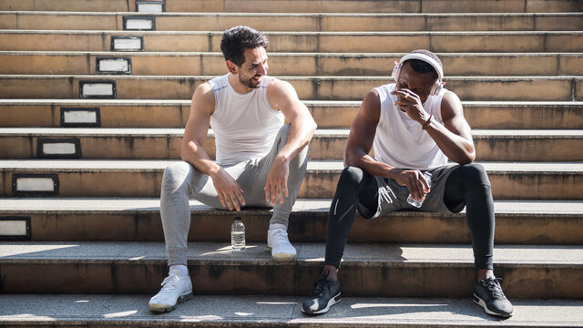 Happy Lgbt Mixed Race Couple Laugh After Exercise