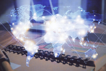 Double exposure of business theme drawings and desk with open notebook background. Concept of...