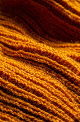 soft knitted plaid of woolen yarn closeup. texture. background