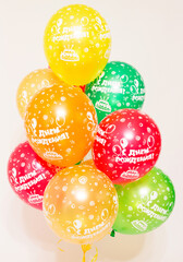 a cloud of helium balloons on a white background. 