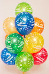 a cloud of helium balloons on a white background. 