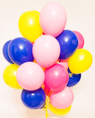 a cloud of helium balloons on a white background. 