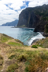 Fototapeta na wymiar Majestic view from Miradouro do Guindaste with high cliffs facing the atlantic ocean, Madeira Island