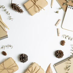 Gift boxes, note book, dry plant on white background. flat lay, top view, copy space
