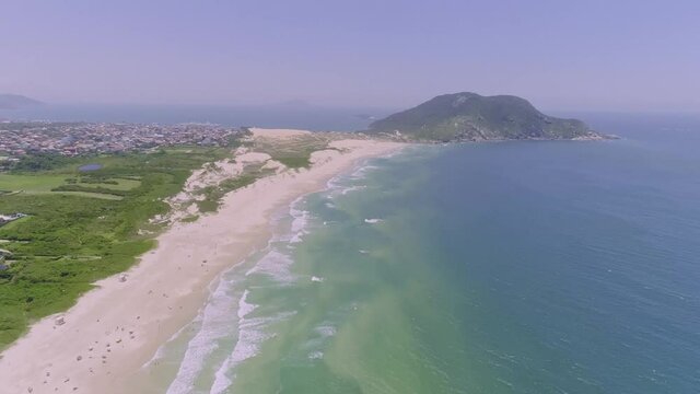 Aerial view of Santinho beach, Florian&oacute;polis, Brazil. Praia do Santinho. 4K.