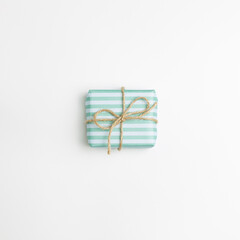 Green stripe pattern gift box isolated on white background. top view, copy space