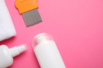 Products for anti lice treatment, metal comb and towel on pink background, flat lay. Space for text