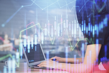 Double exposure of businesswoman hands typing on computer and forex chart hologram drawing. Financial analysis concept.