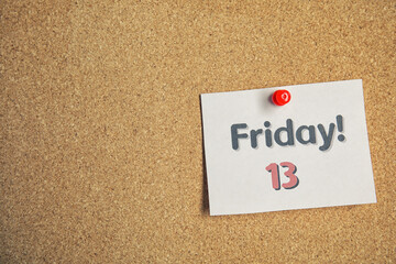 Paper note with phrase Friday! 13 pinned to cork background, space for text. Bad luck superstition