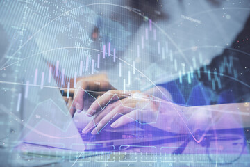 Multi exposure of woman hands typing on computer and financial graph hologram drawing. Stock market analysis concept.