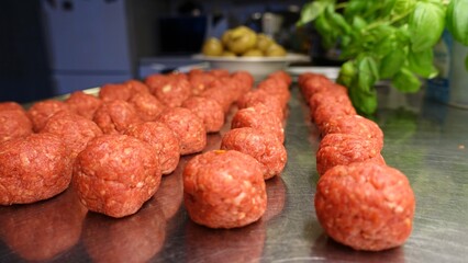 Homemade meatballs on the kitchen counter ready to be cooked