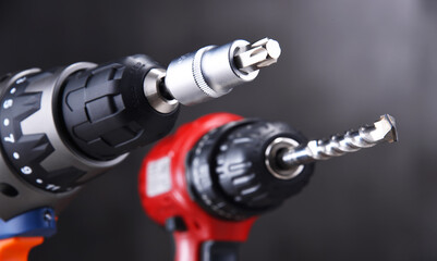 A screw gun and a pistol-grip cordless drill