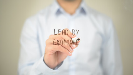 Lead by Example , Man writing on transparent screen