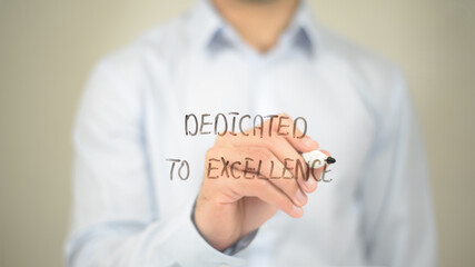 Dedicated to Excellence, Man writing on transparent screen
