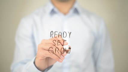 Ready Set Grow, Man Writing on Transparent Screen