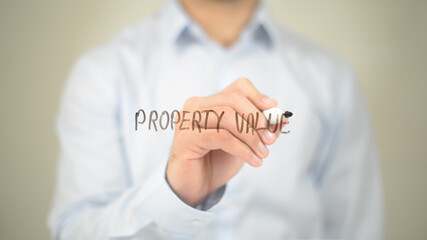 Property Value , Man writing on transparent screen