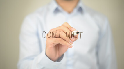 Don't Wait, Man writing on transparent screen