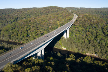 Aerial view of the Pacific Motorway (M1) and the 74m high twin cantilever Mooney Mooney Creek...