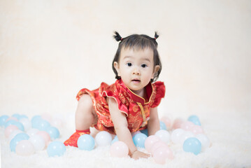 Chinese cute baby girl traditional dressing up celebrate Chinese new year, Selective focus