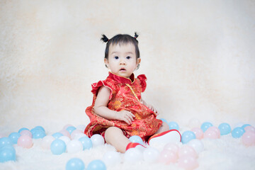 Chinese cute baby girl traditional dressing up celebrate Chinese new year, Selective focus