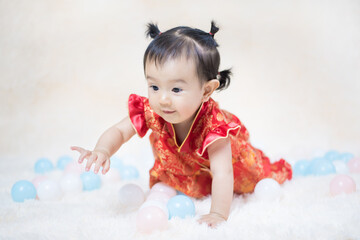 Chinese cute baby girl traditional dressing up celebrate Chinese new year, Selective focus