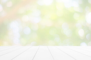 Abstract White Wooden Table with Beautiful Bokeh in the Garden Background.